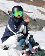 Janneke Berghuis smiling in the snow with rocks behind her.