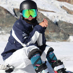 Janneke Berghuis, sitting with her ski pants rolled up. 