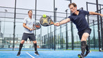 Ronald de Boer reaching for the ball while playing padel.