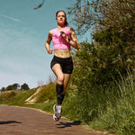 Jill Holterman jogging on a stone path. 