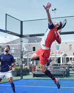 Uriël Maarsen jumping with his hand in the air. 